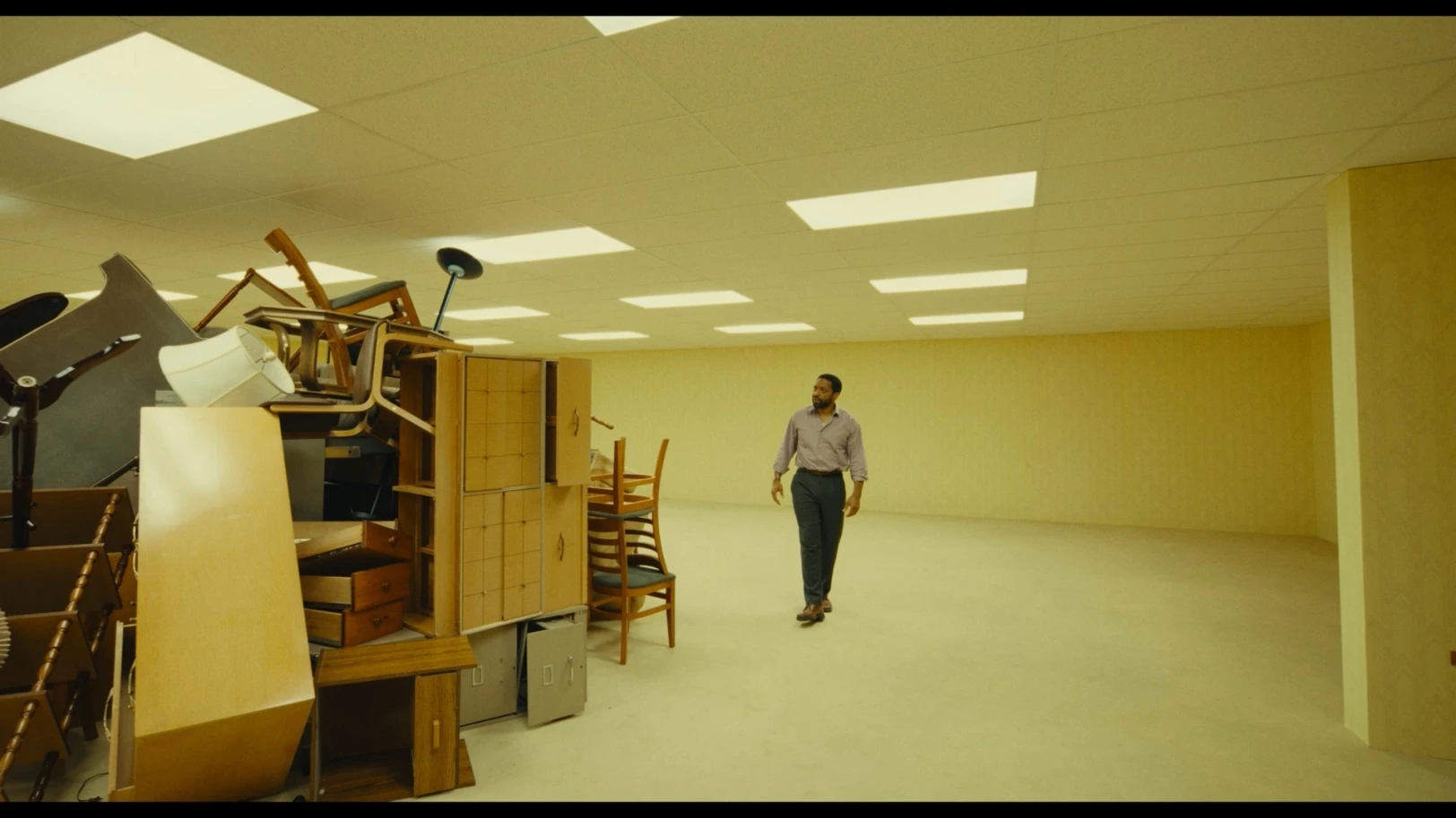 Clark investigating a pile of furniture