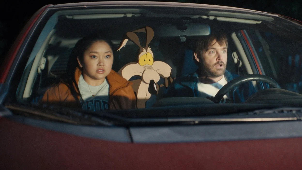 Kevin, Wile E. Coyote, and Paige blinded by a light outside their car